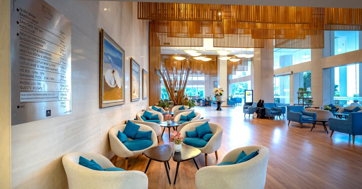 Spacious hotel lobby featuring stylish seating and contemporary decor with natural light.