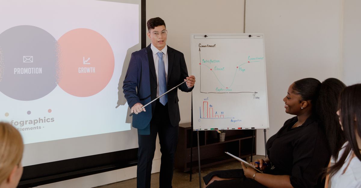 Young professional presents growth strategy using charts and graphs in a meeting.