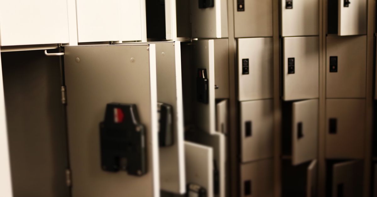 A row of open lockers in a secure indoor storage area, ideal for storing valuables.